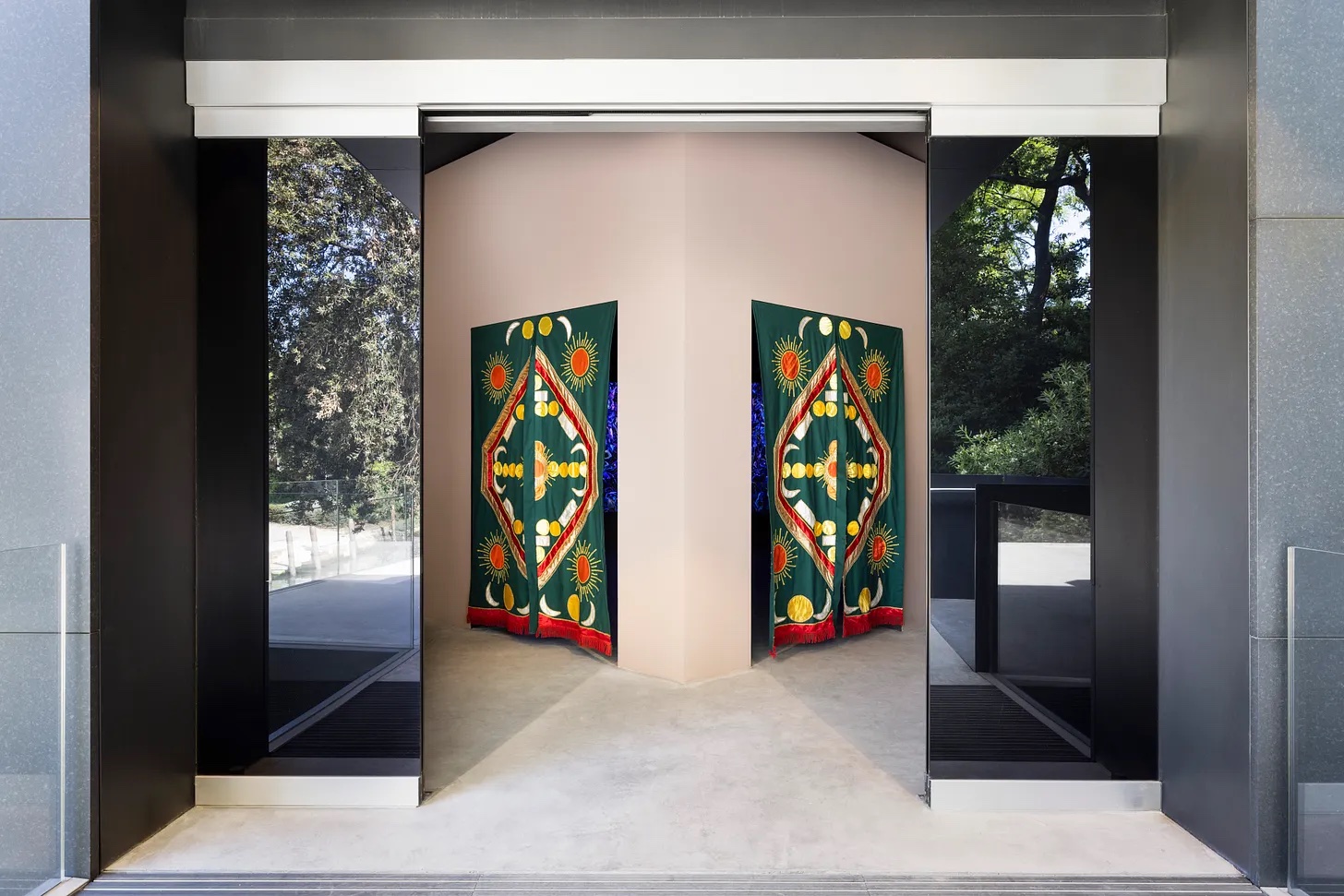 Entrance to the Australia Pavilion showing green embroidered textiles for Khaled Sabsabi installation
